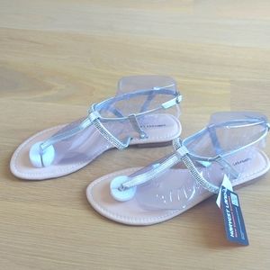 Silver sandals with diamond accent.